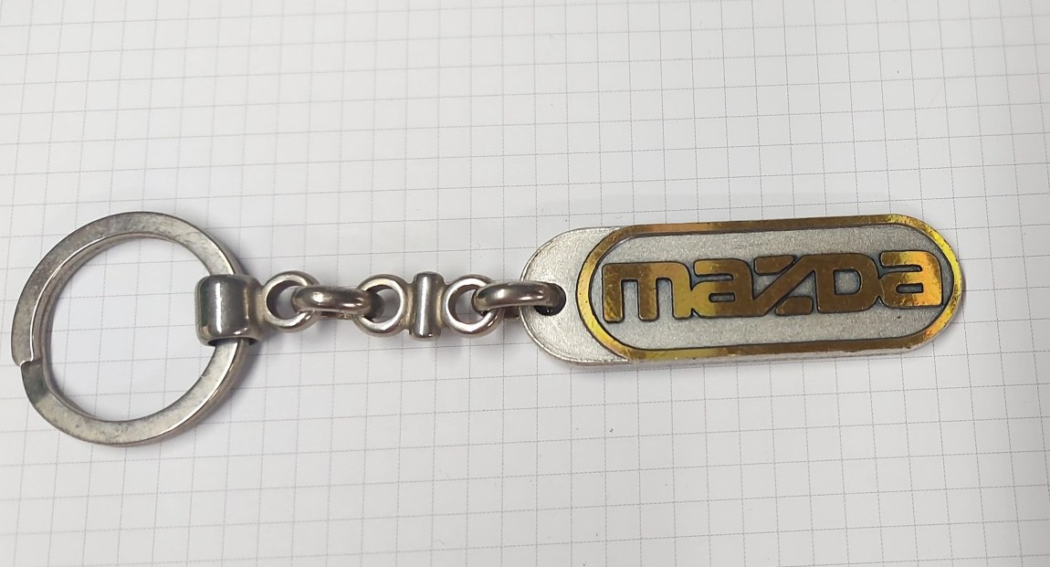 Přívěsek Mazda - Železářství Klíče, příslušenství Příslušenství, přívesky, visačky